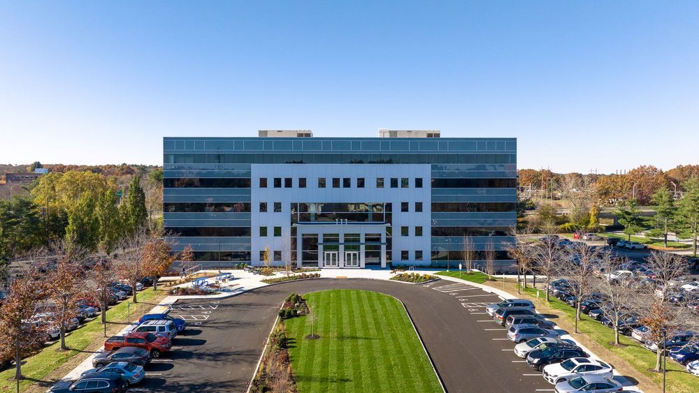 Front elevation of the 111 Speen Street office building, viewed along the landscaped approach drive.