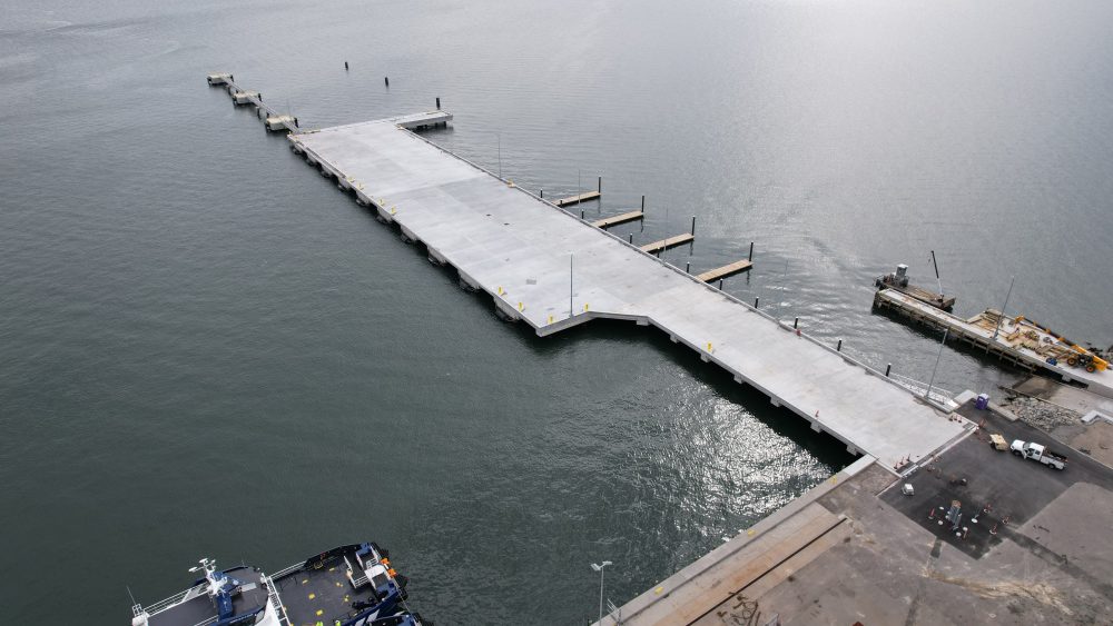 The completed Terminal 5 pier extending over the water at the Port of Davisville.
